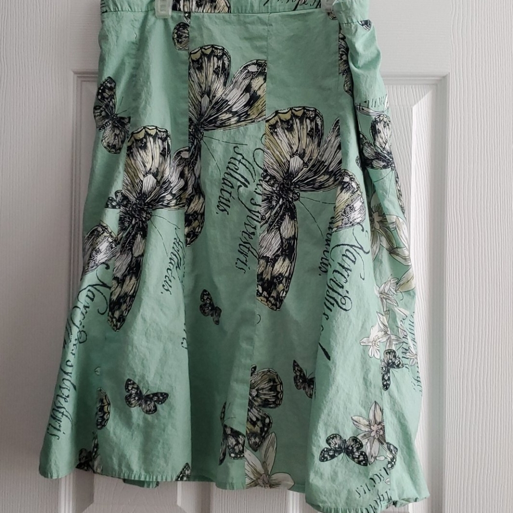 Green skirt with butterfly pattern